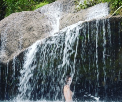 Waterfall shower at El Nicho natural pools